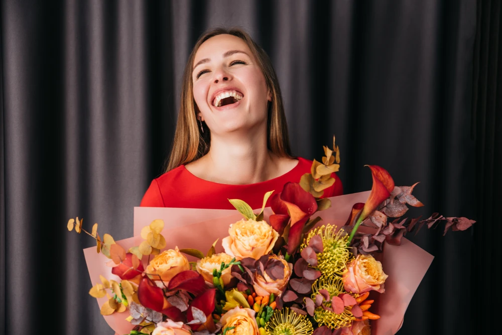 woman-holding-bouquet-flowers-white-hydrangea-flowers-smiling